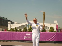 Gordon Banks with the 2012 torch, in front of Wembley Arena